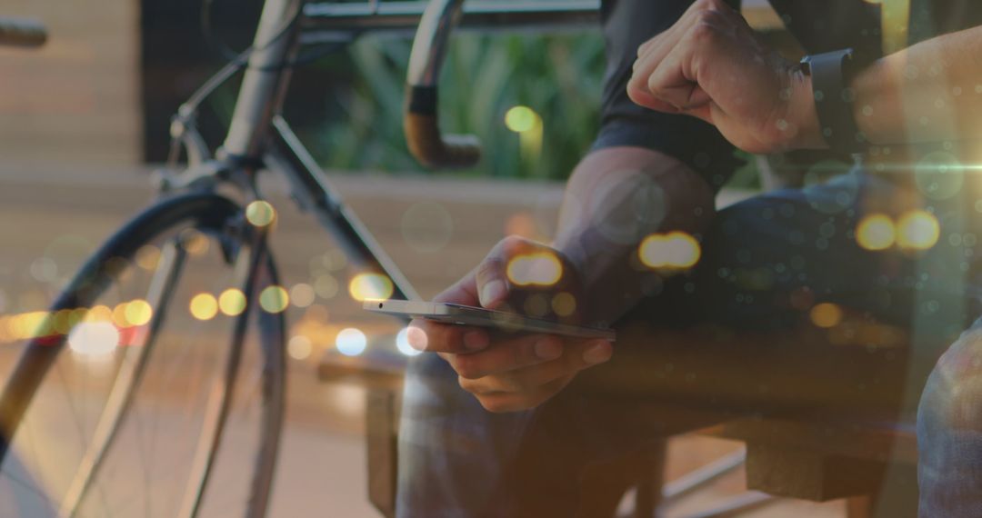 Cyclist Using Smartphone Amid Urban Backdrop Imagery