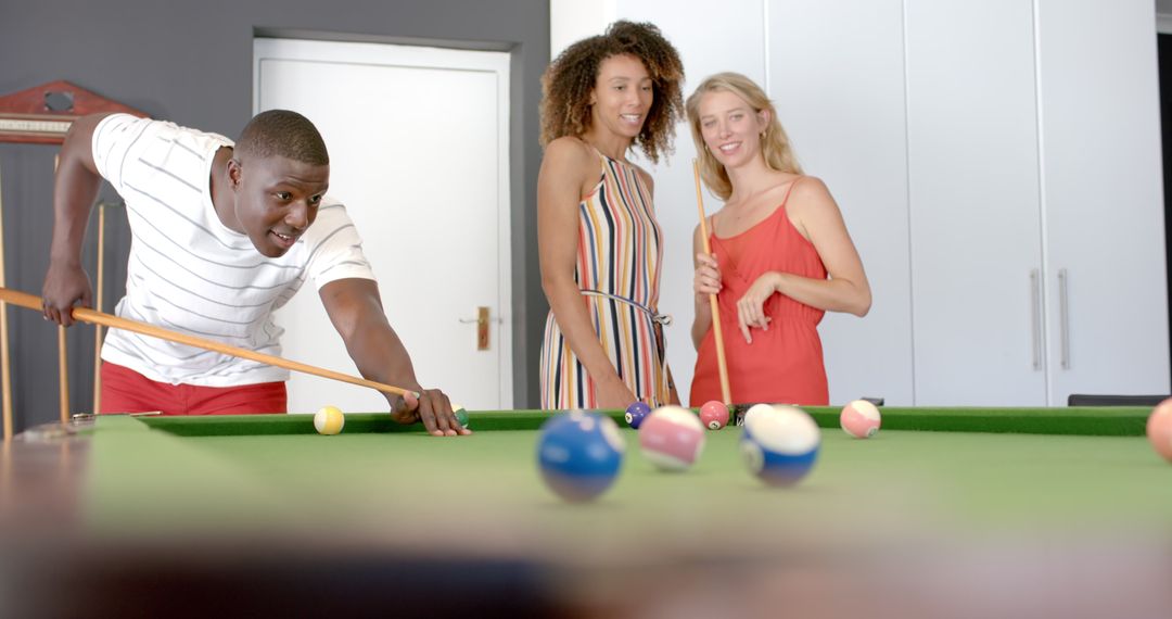 Diverse Friends Enjoying Game of Pool Together Indoors