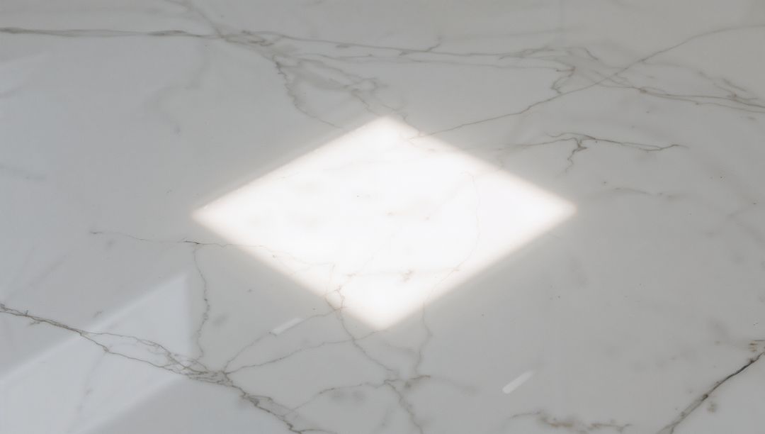 Sunlight Diamond Patch on Polished White Marble Slab with Subtle Veining and Reflection