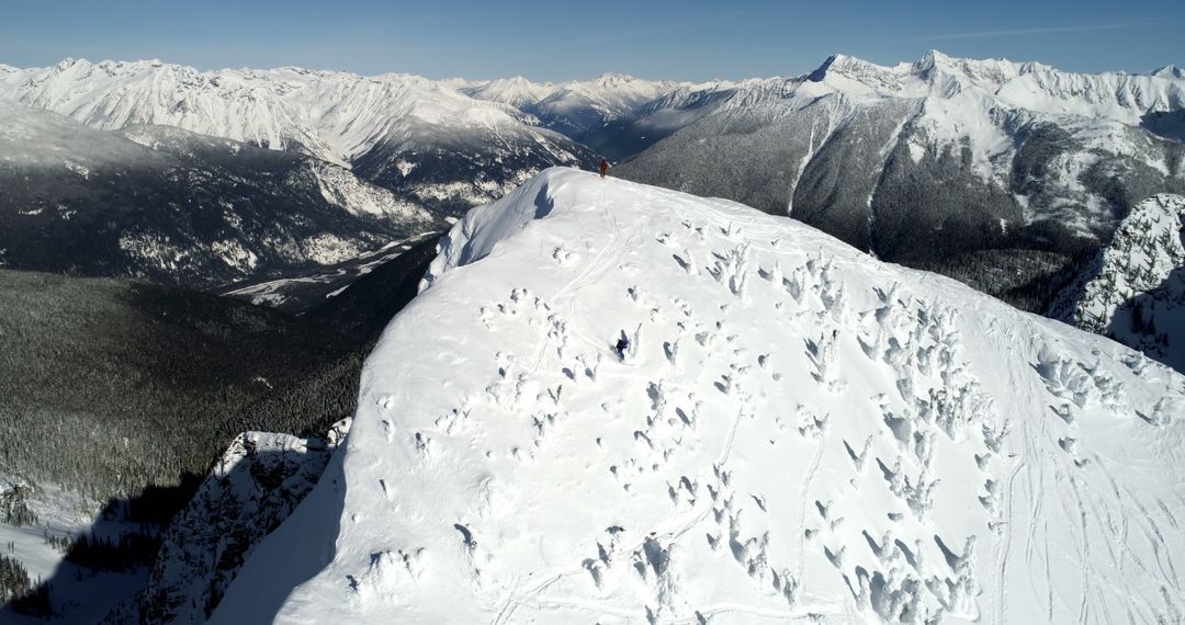 Aerial View of Snow-covered Mountain Peaks in Winter - Free Images, Stock Photos and Pictures on Pikwizard.com