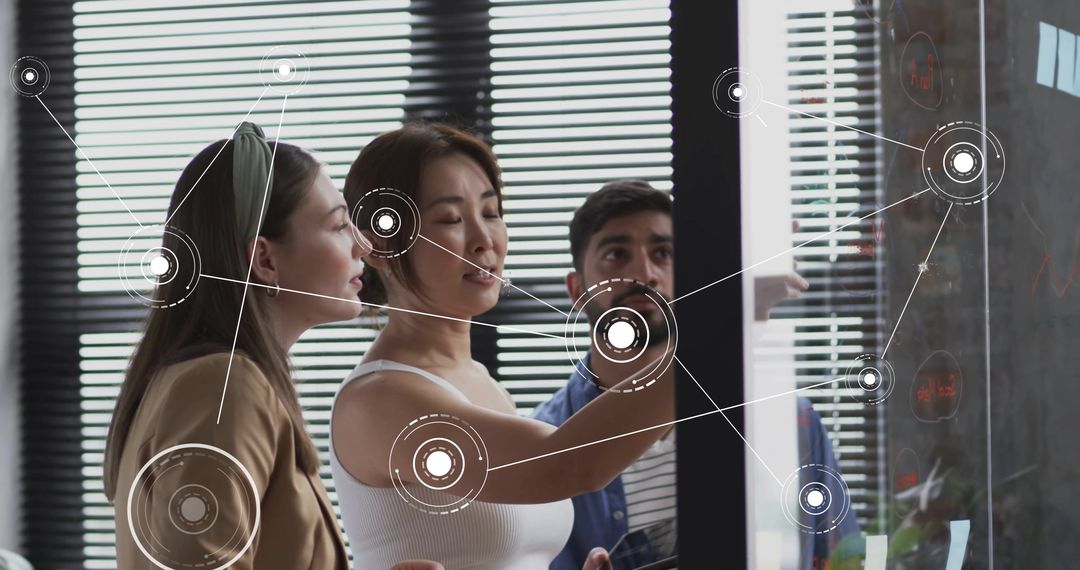 Team Collaborating on Digital Strategy with Data Visualization in Office