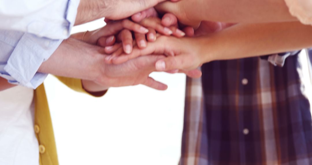 Group of People Stacking Hands Showing Unity and Teamwork - Free Images, Stock Photos and Pictures on Pikwizard.com