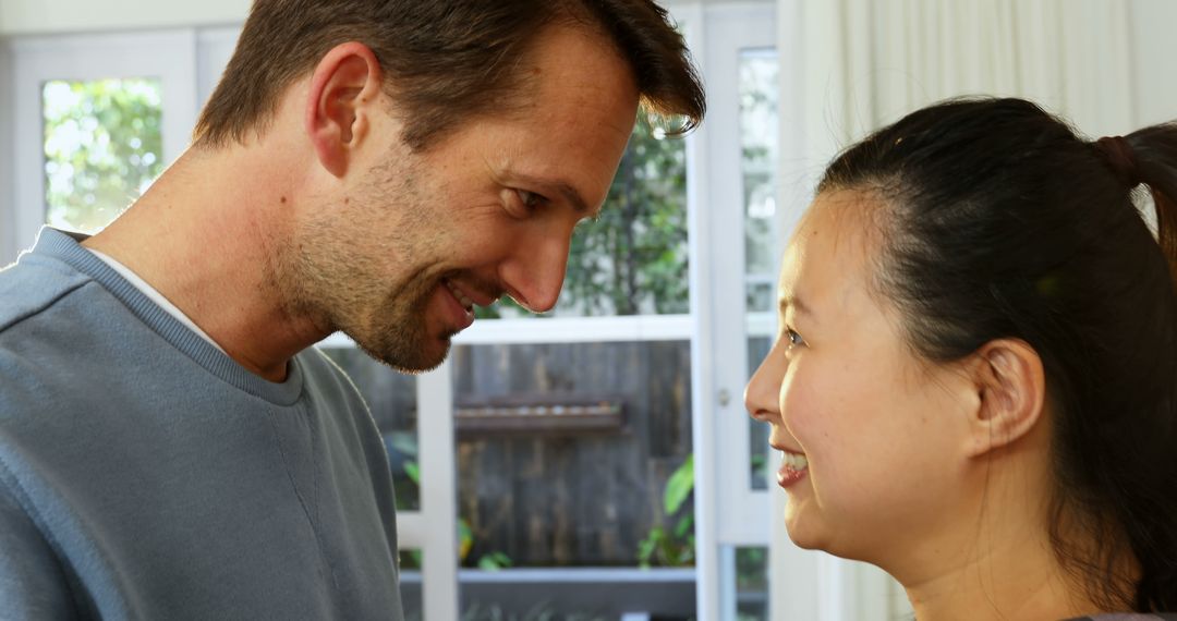 Close-Up Of Smiling Couple Facing Each Other - Free Images, Stock Photos and Pictures on Pikwizard.com