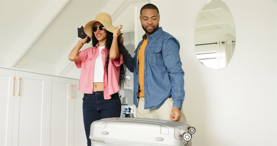 Couple Preparing for Vacation Excitedly Packing Suitcase at Home