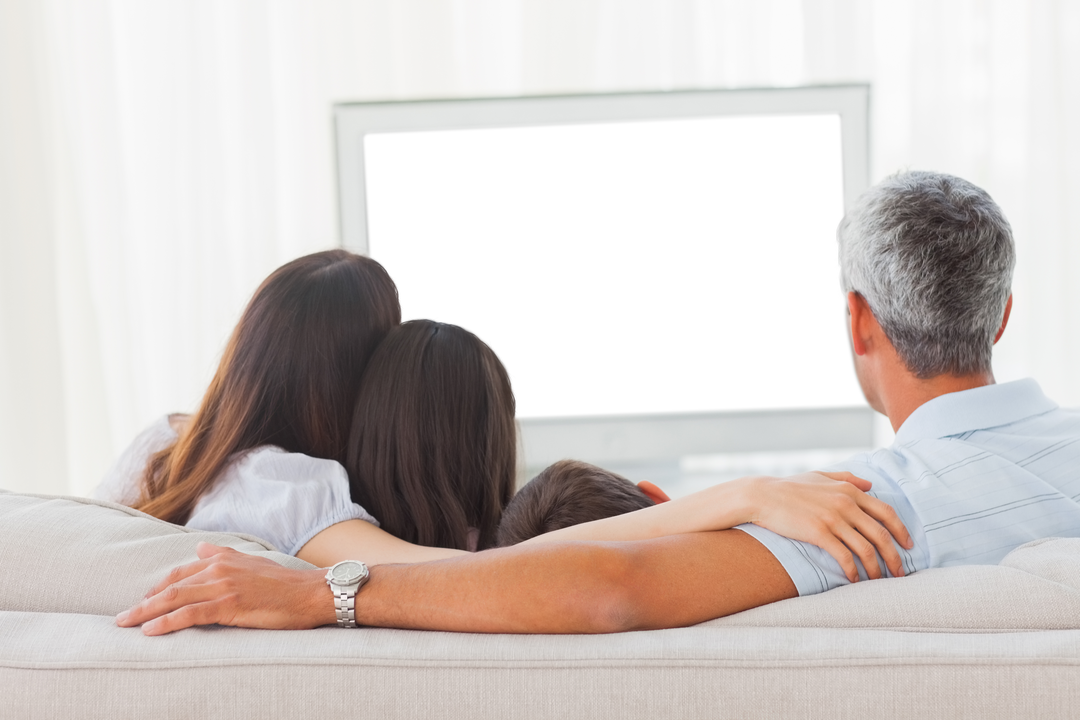 Family Enjoying Television on Sofa with TV Screen Area Transparent - Download Free Stock Images Pikwizard.com