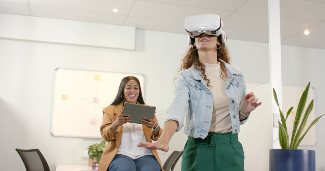 Diverse Colleagues Engaging with Virtual Reality in Office Environment