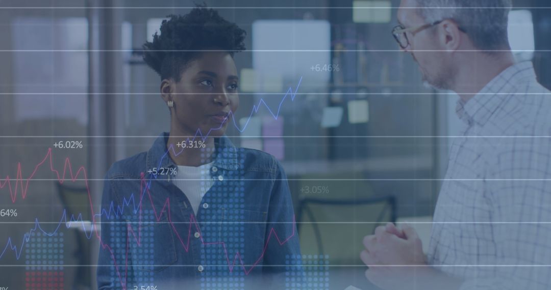 Diverse Coworkers Analyzing Statistics and Graphs in Modern Office