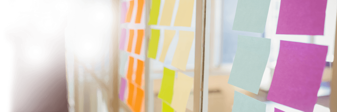 Transparent Glass Office Wall with Colorful Sticky Notes
