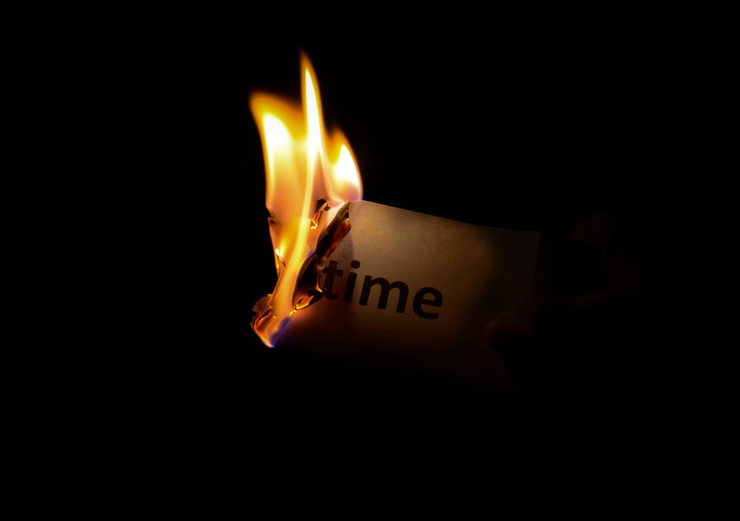 Burning Paper with 'Time' Written on It, Symbolizing Passage and Urgency - Free Images, Stock Photos and Pictures on Pikwizard.com