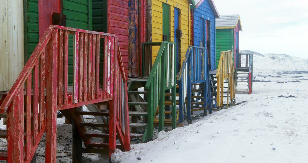 Colorful beach huts on snowy beach - Free Images, Stock Photos and Pictures on Pikwizard.com