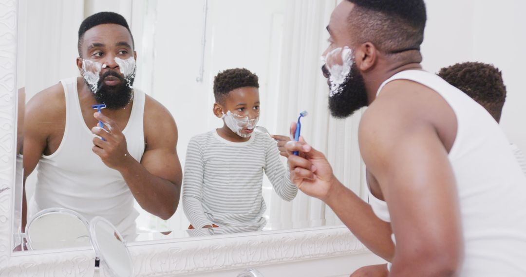 Father Teaching Son to Shave in Bathroom Mirror, Bonding Moment - Free Images, Stock Photos and Pictures on Pikwizard.com