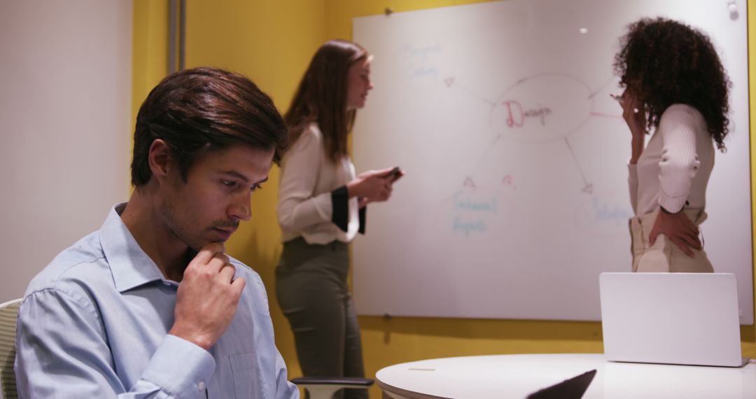 Team brainstorming ideas on whiteboard in modern office - Free Images, Stock Photos and Pictures on Pikwizard.com