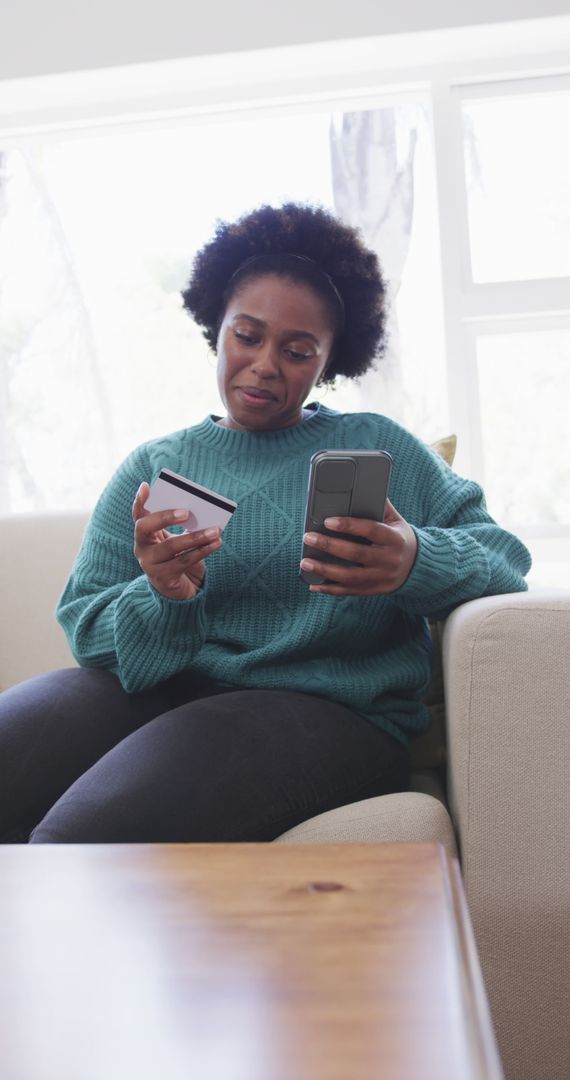 Woman Using Smartphone for Online Shopping at Home
