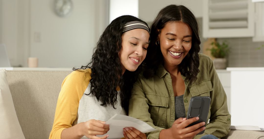 Mother and Daughter Enjoying Connection with Technology at Home