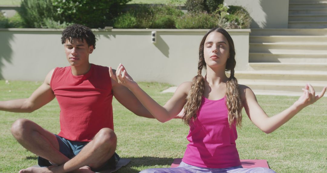 Couple meditating outdoors for mindful relaxation