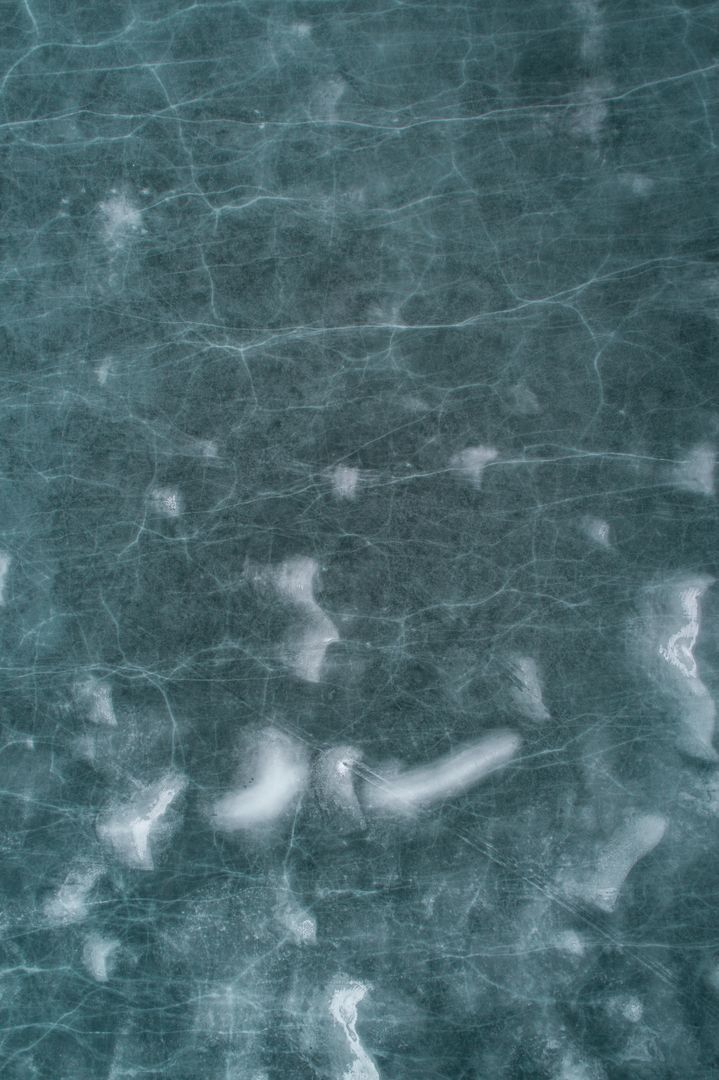 Close-up View of Frozen Surface with Light Cracks - Free Images, Stock Photos and Pictures on Pikwizard.com