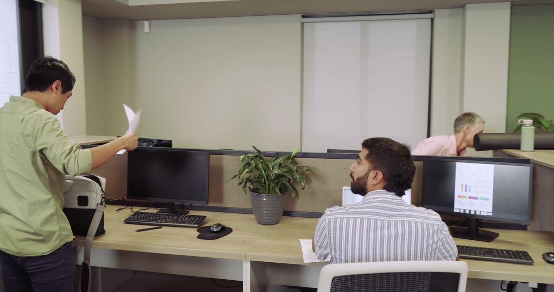 Modern Office Team Collaboration with Dual Monitors