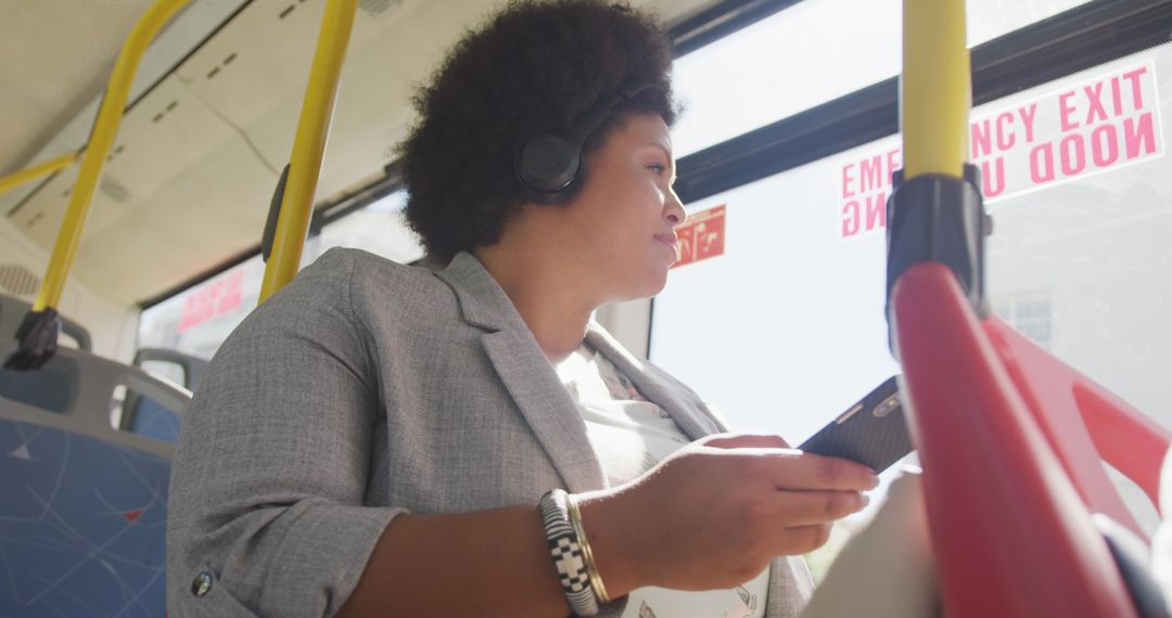 Happy Plus-Size Woman with Smartphone on Bus