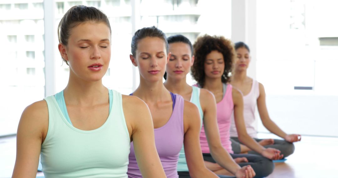 Group of Women Meditating in Yoga Class - Free Images, Stock Photos and Pictures on Pikwizard.com