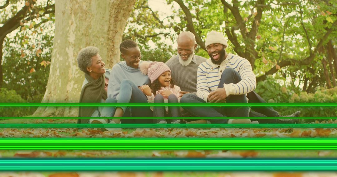 Multigenerational family laughing on autumn leaves with sweaters and green glitch lines