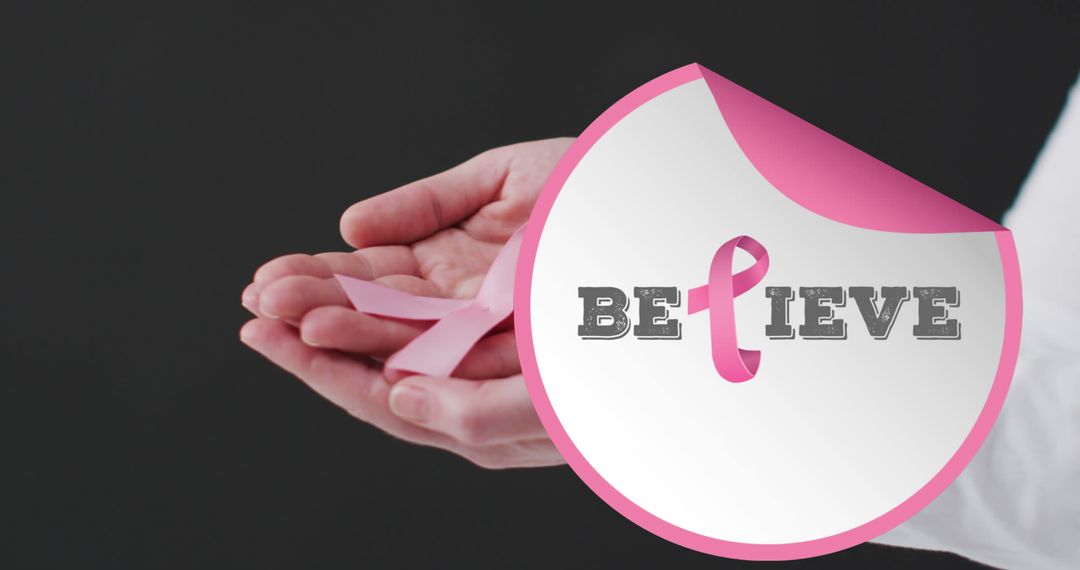 Hands Holding Pink Breast Cancer Awareness Ribbon with Believe Message - Free Images, Stock Photos and Pictures on Pikwizard.com