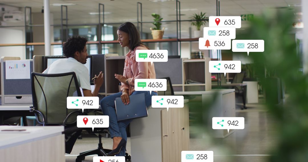 Coworkers Discussing with Social Media Notifications in Office