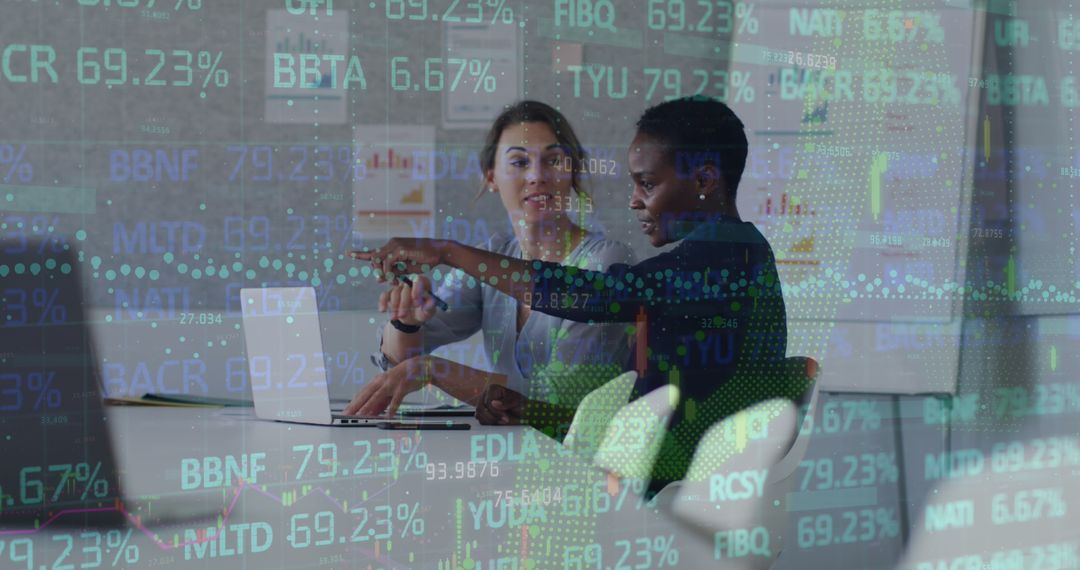 Two Businesswomen Analyzing Financial Data on Laptop in Office - Free Images, Stock Photos and Pictures on Pikwizard.com