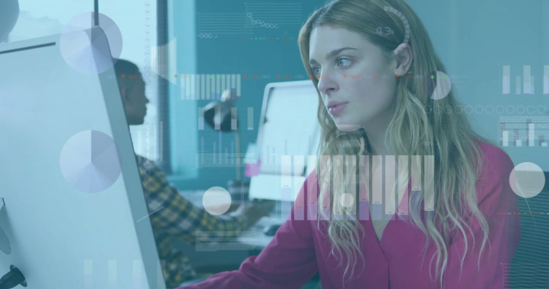 Focused Businesswoman Analyzing Data on a Computer in Modern Office