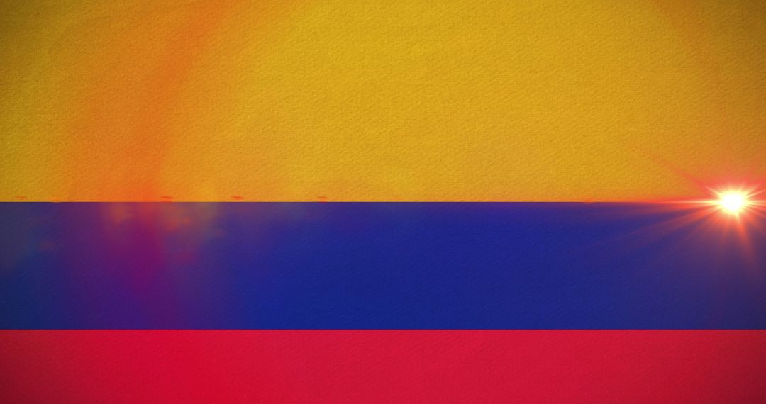Vibrant Colombian Flag with Sun Flare Highlighting Symbolism