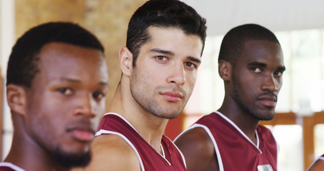 Group of Focused Basketball Players in Red Jerseys Looking Determined - Free Images, Stock Photos and Pictures on Pikwizard.com