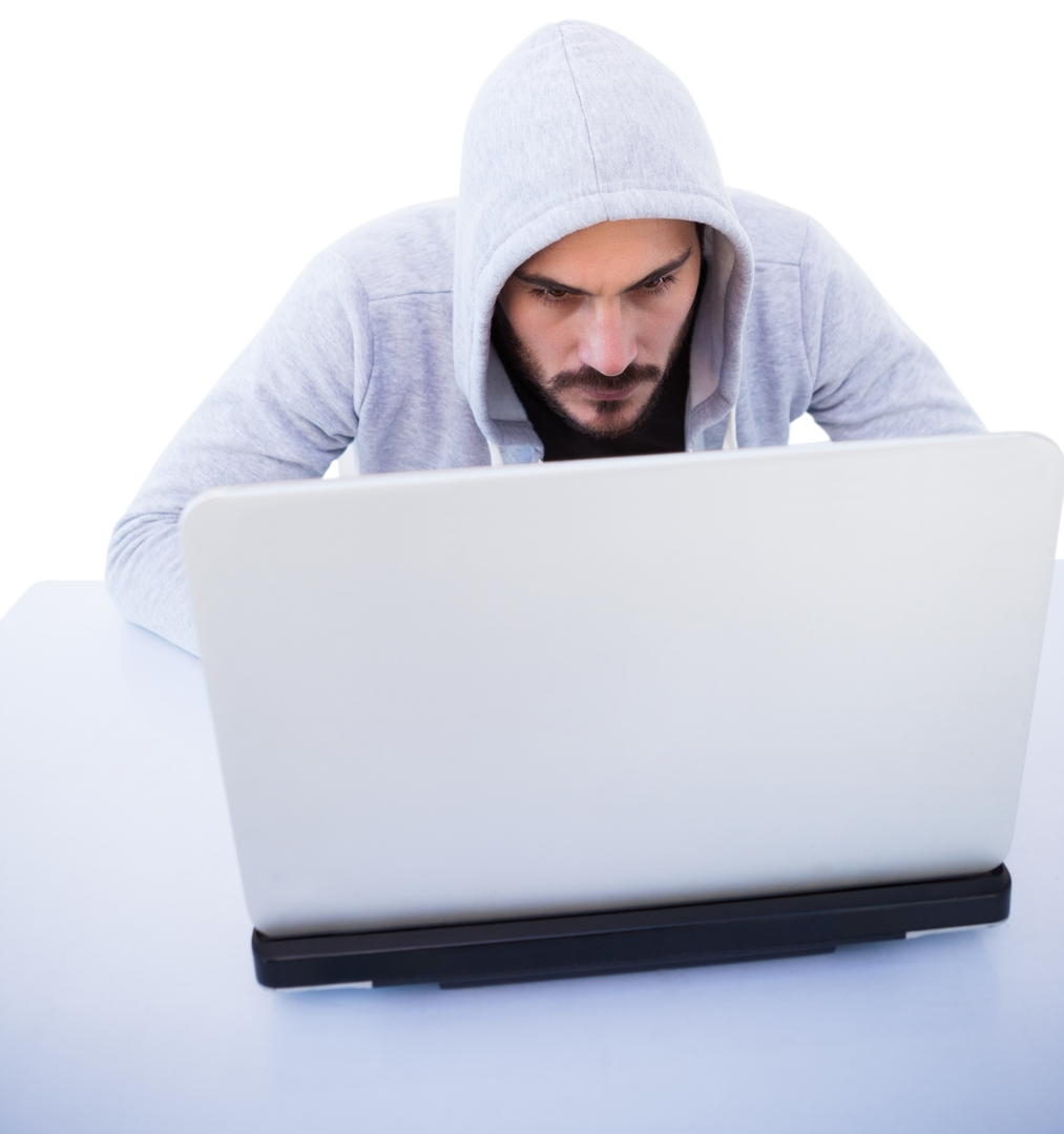 Masked Hooded Man Seriously Focusing on Laptop on Transparent Background - Download Free Stock Images Pikwizard.com