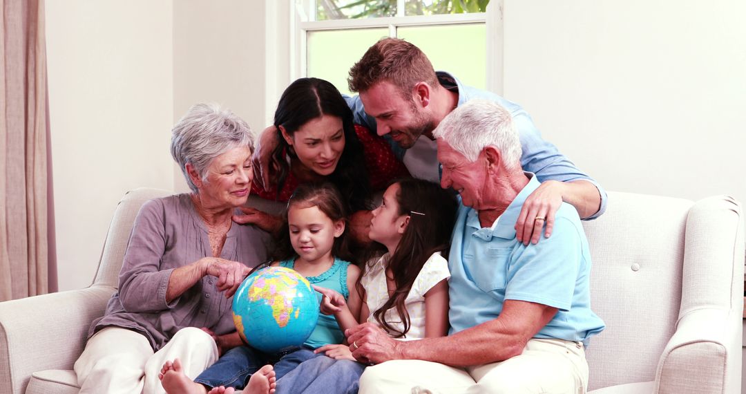 Multigenerational Family Bonding On Couch With World Globe - Free Images, Stock Photos and Pictures on Pikwizard.com