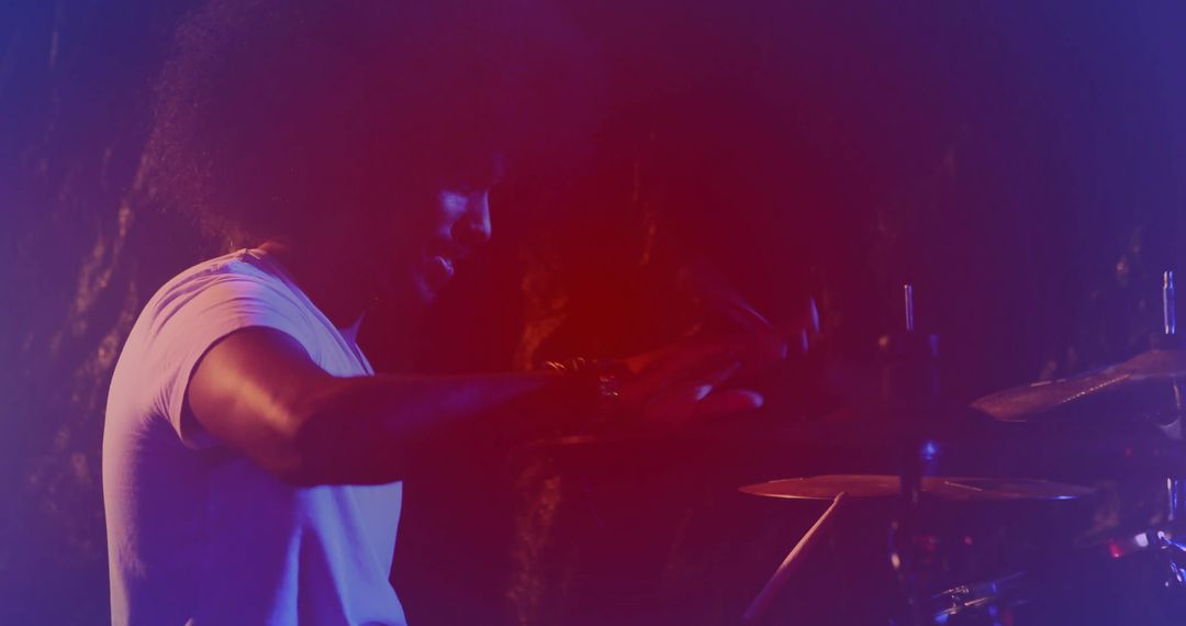 Energetic Drummer Performing with Passion on Stage