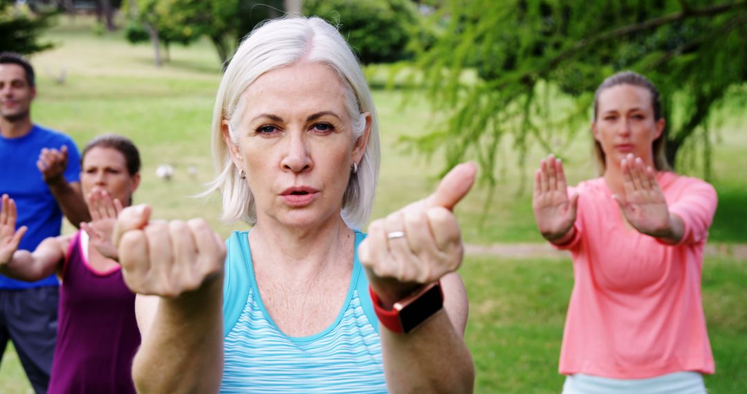 Senior Woman Leading Outdoor Group Fitness Class - Free Images, Stock Photos and Pictures on Pikwizard.com