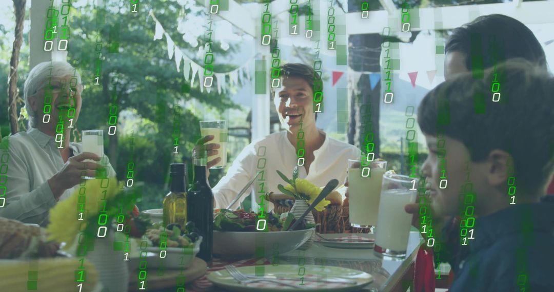 Multigenerational family toasting at garden table with green binary code digital overlay