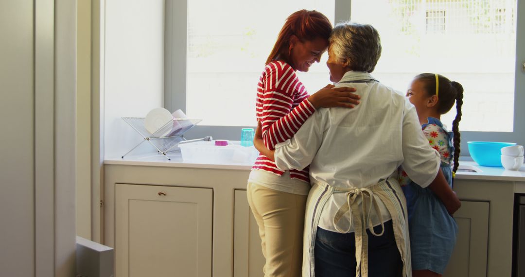 Three Generations of Women Hugging in Bright Kitchen - Free Images, Stock Photos and Pictures on Pikwizard.com