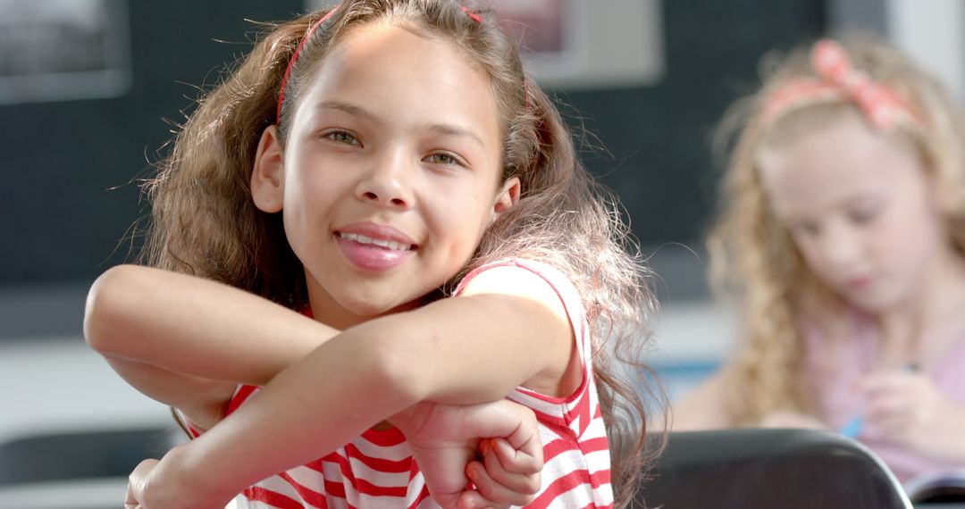 Happy Girl Smiling and Relaxing in Classroom