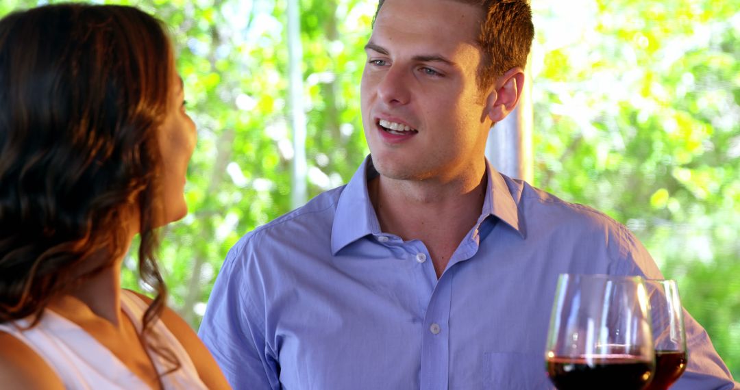 Casual Conversation Over Wine at a Social Gathering