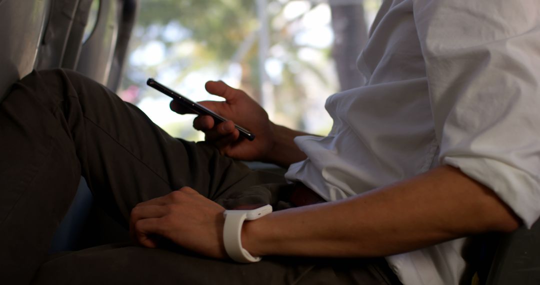 Person Sitting on Bus Using Smartphone - Free Images, Stock Photos and Pictures on Pikwizard.com