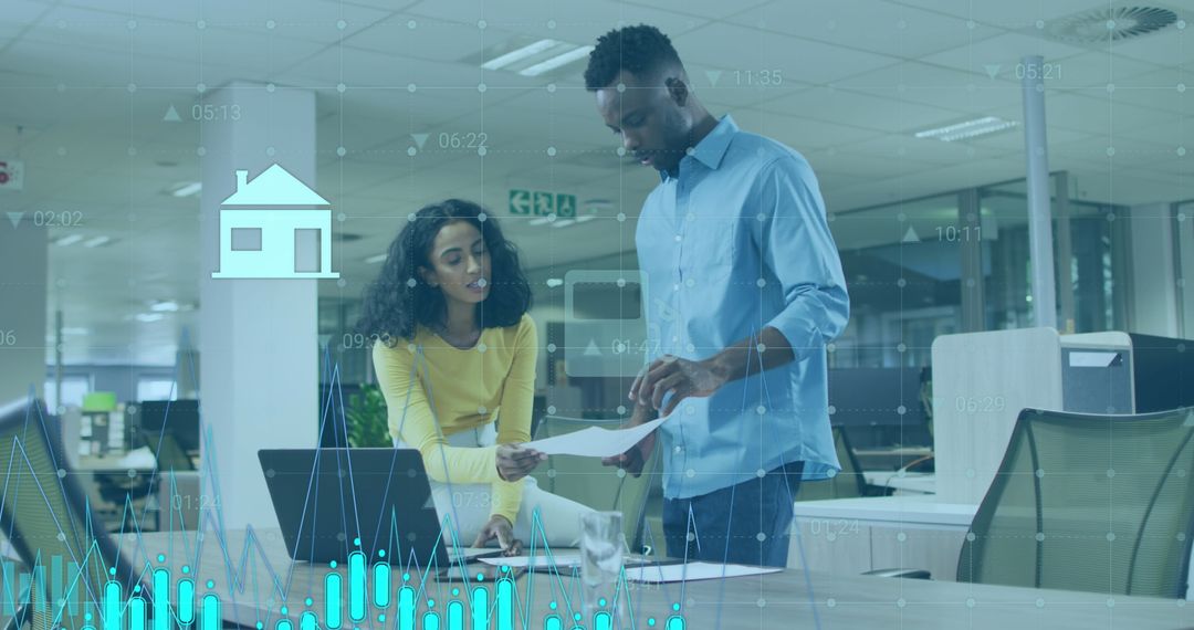 Diverse Business Team Discussing Financial Analytics in Modern Office