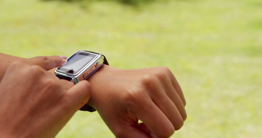 Close-Up of Person Interacting with Modern Smartwatch Outdoors - Free Images, Stock Photos and Pictures on Pikwizard.com