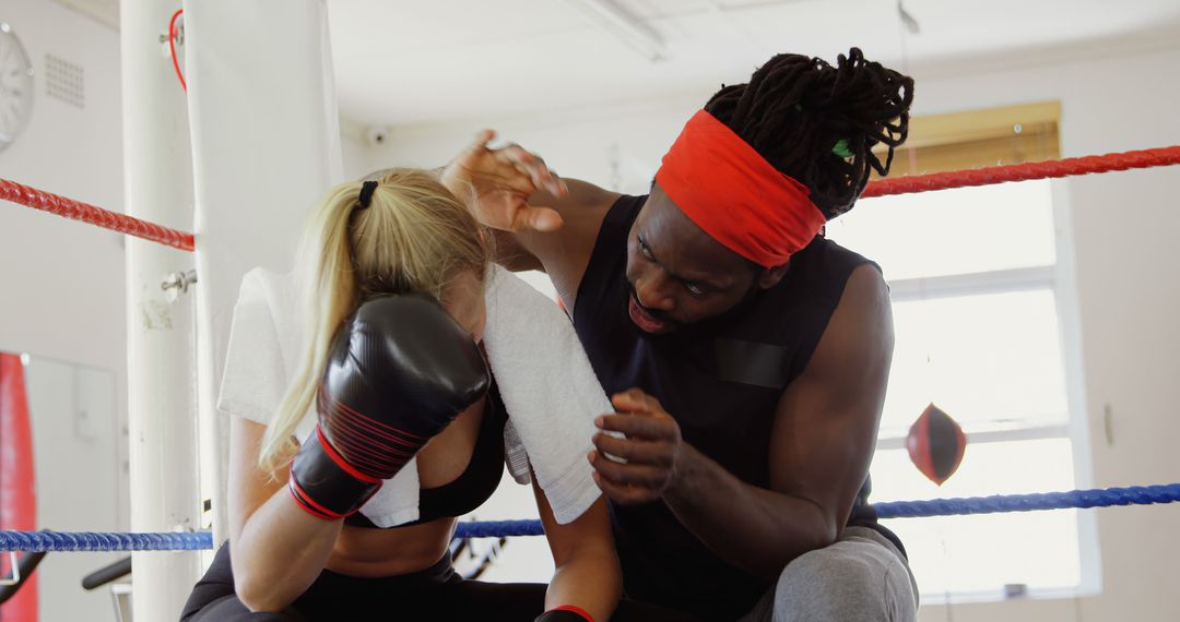 Personal Trainer Coaching Female Boxer in Boxing Ring - Free Images, Stock Photos and Pictures on Pikwizard.com