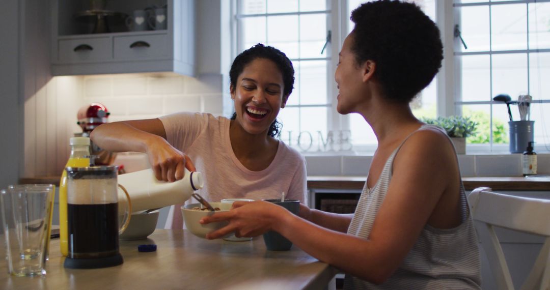 Two Women Enjoying Breakfast Together at Home - Free Images, Stock Photos and Pictures on Pikwizard.com