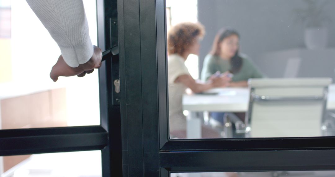 Businessman Opening Door to Join Office Meeting