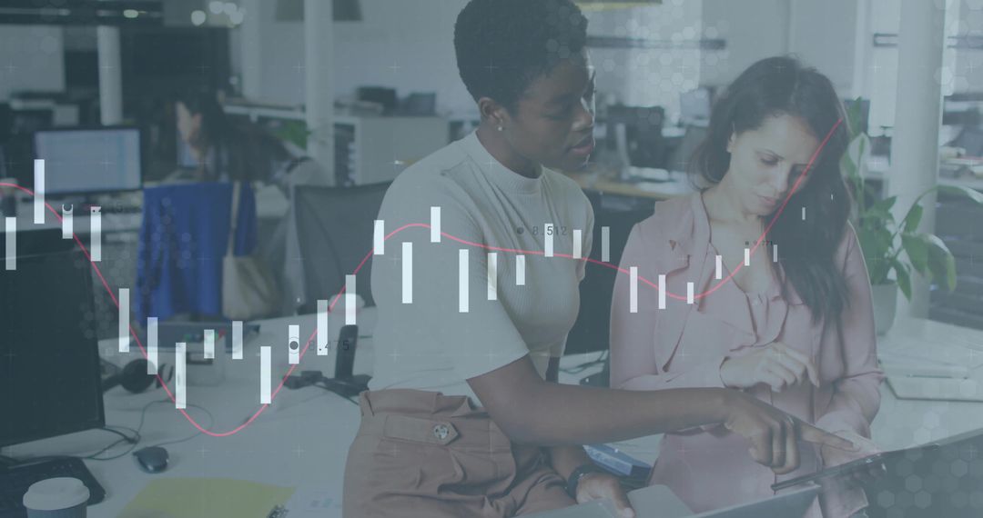 Colleagues Exploring Financial Data in Modern Office