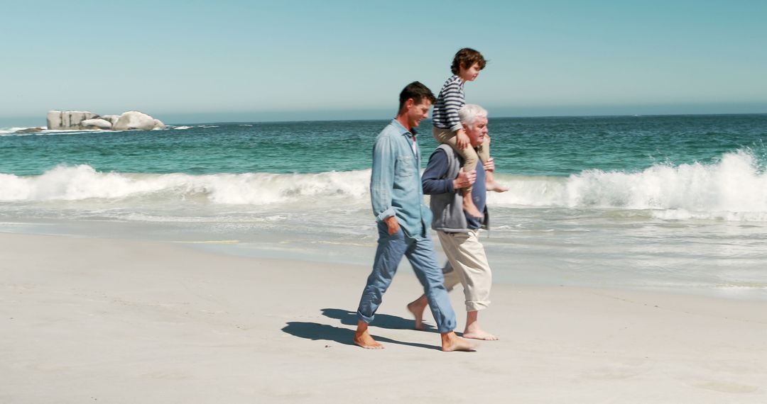 Three Generations of Family Walking Along Beachside - Free Images, Stock Photos and Pictures on Pikwizard.com