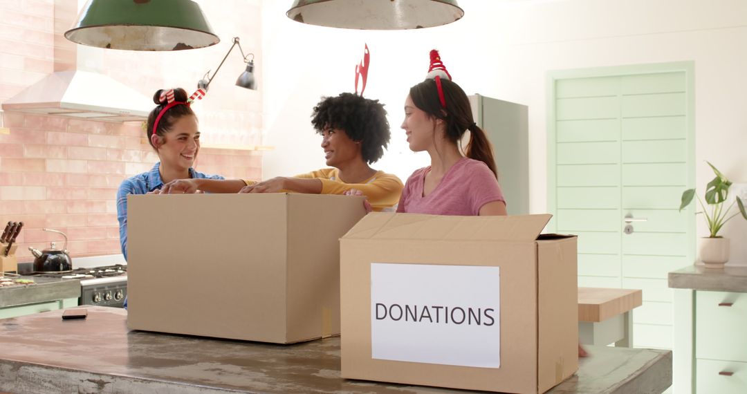 Diverse Women Organizing Donation Boxes in Kitchen