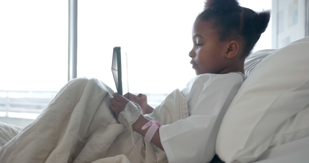 Young Girl Using Tablet in Hospital Bed - Free Images, Stock Photos and Pictures on Pikwizard.com