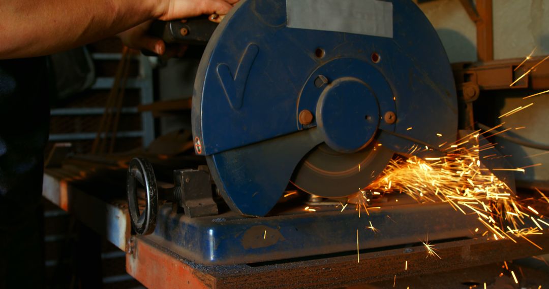 Worker Operating Industrial Cutting Machine with Sparks Flying - Free Images, Stock Photos and Pictures on Pikwizard.com