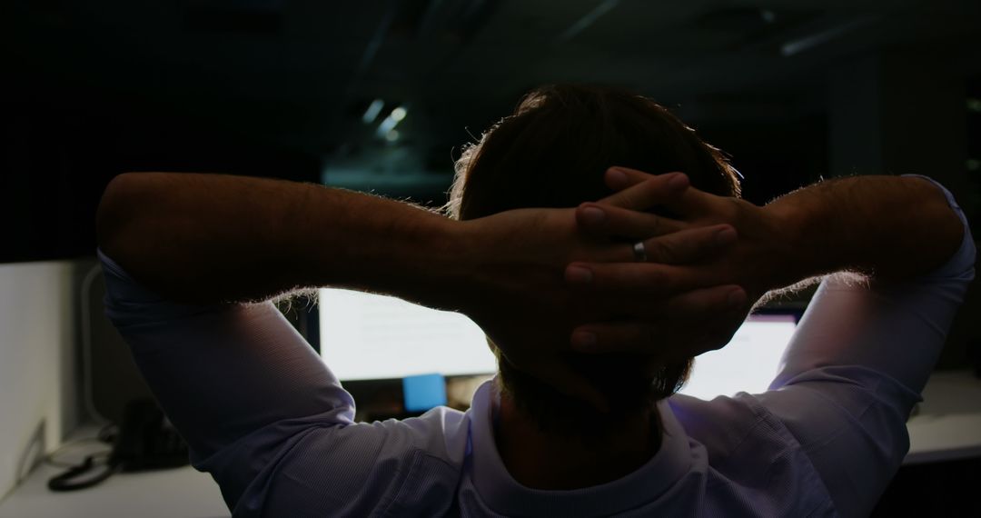 Tired Businessman Relaxing in Office while Staring at Computer Screen